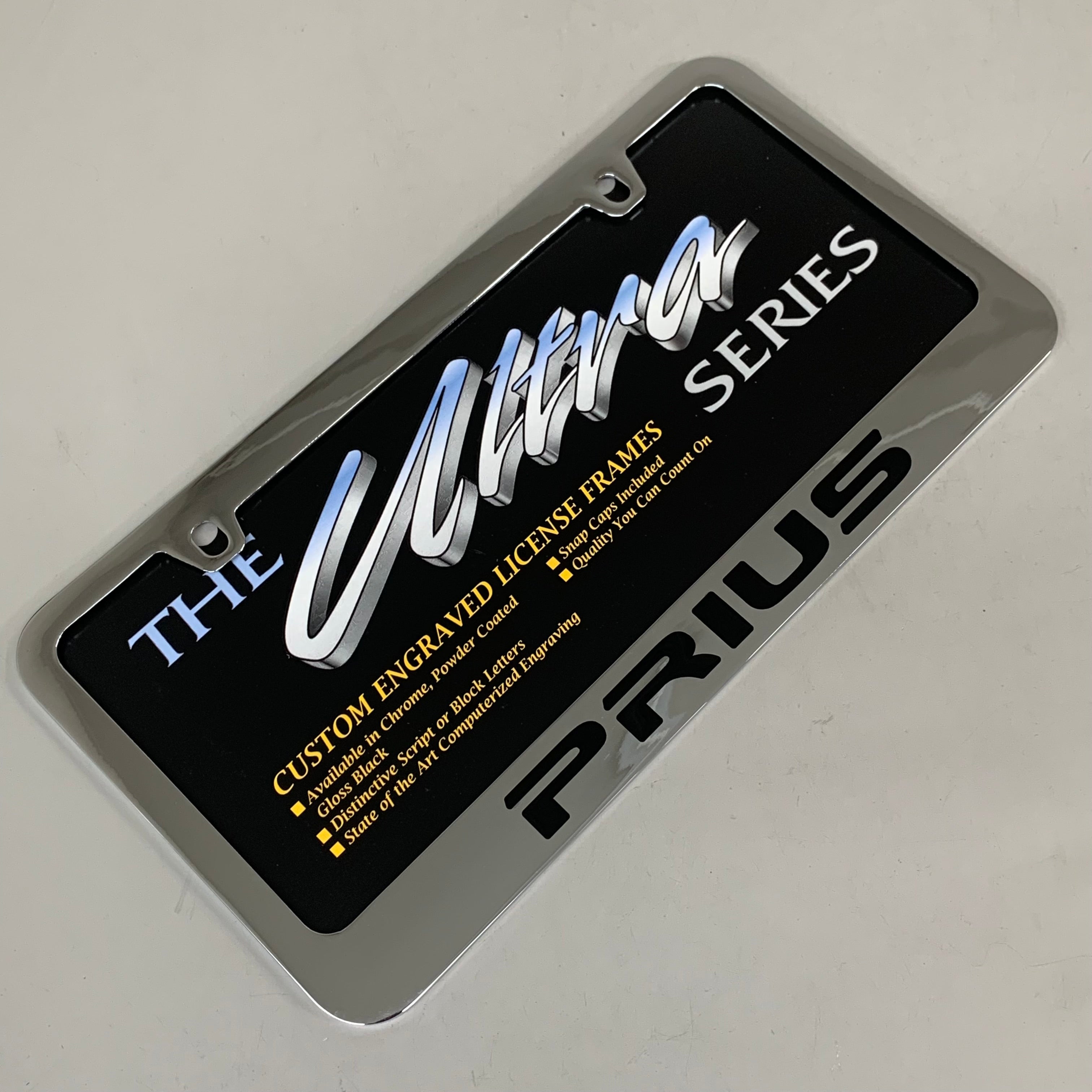 ELITE AUTOMOTIVE PRODUCTS Pruis Emblem Solid Brass License Plate Frame Chrome