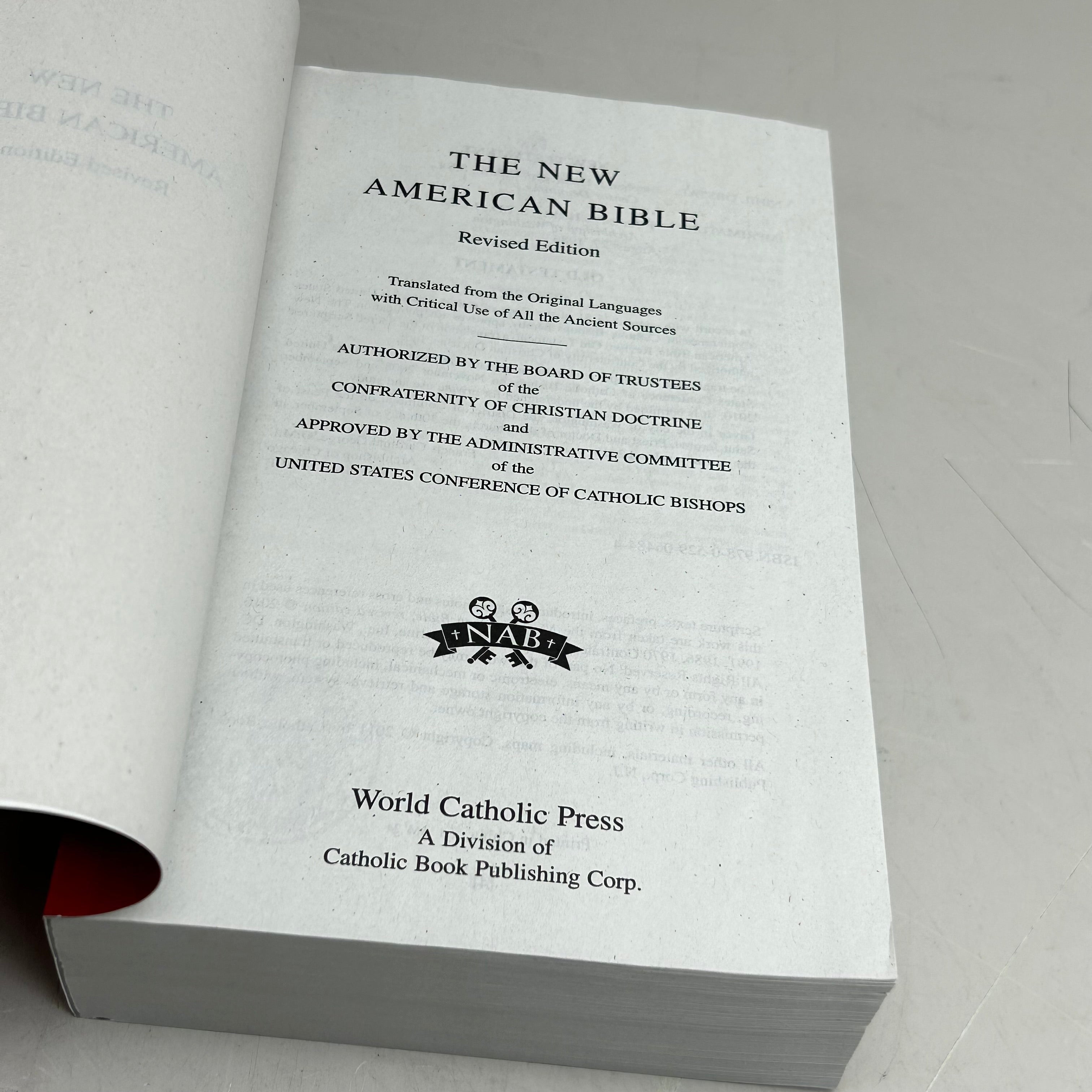 WORLD BIBLE PUBLISHING The New American Bible Revised Edition  1394 Pages Red